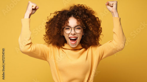 Photo of cheerful funny laughing girl raise fists in victory triumph win in lottery prize isolated on beige color background