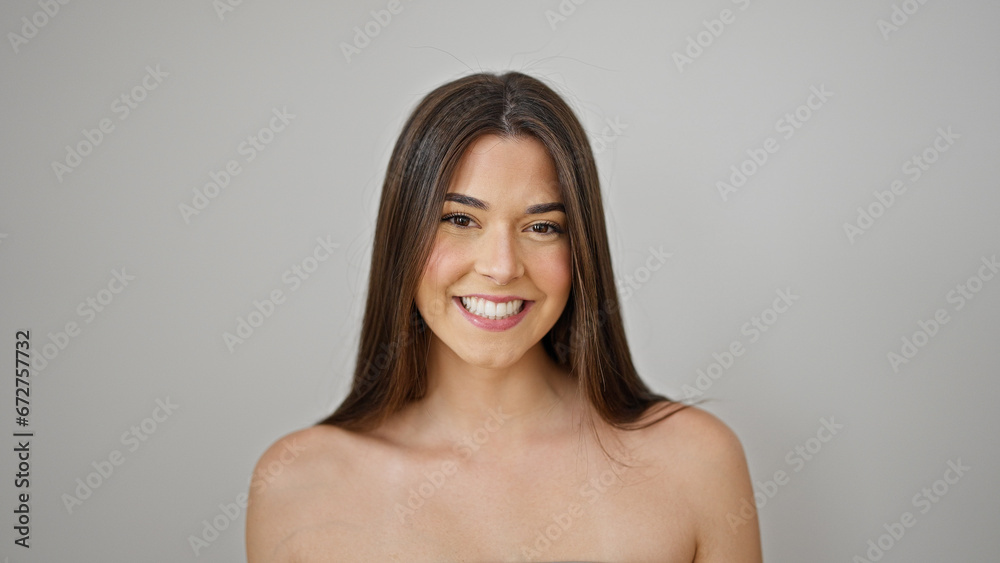Obraz premium Young beautiful hispanic woman smiling confident standing over isolated white background