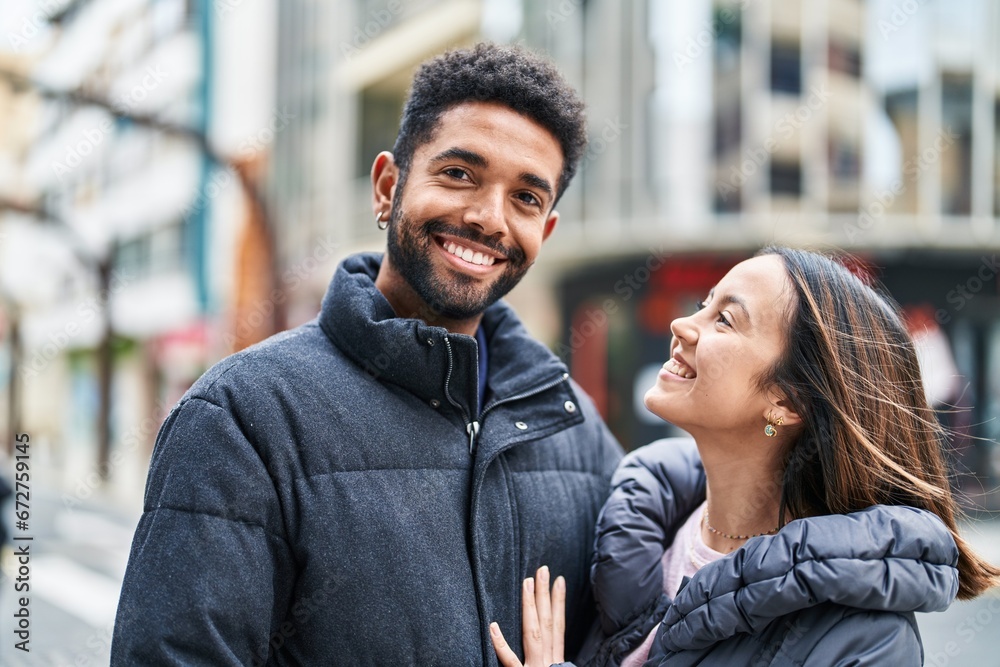 Man and woman couple smiling confident hugging each other at street Man and woman couple smiling confident hugging each other at street