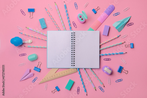 Back to school background. Stationery on a pink background. Bright stationery in pastel colors for schoolchildren. There is a copy space