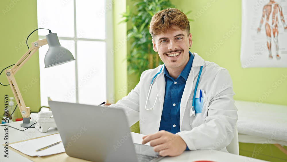 Young hispanic man doctor using laptop smiling at the clinic Young hispanic man doctor using laptop smiling at the clinic