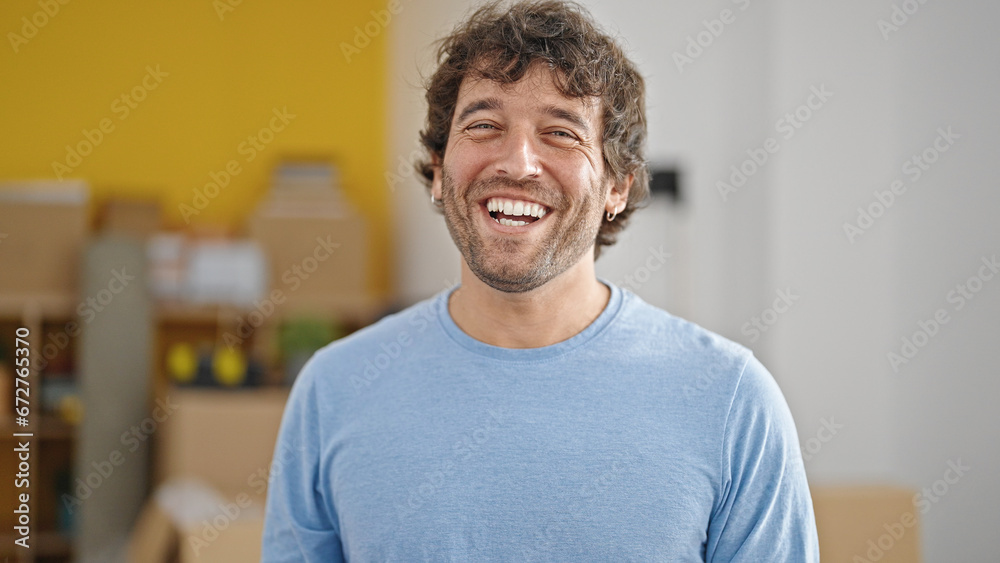 Young hispanic man smiling confident standing at new home Young hispanic man smiling confident standing at new home