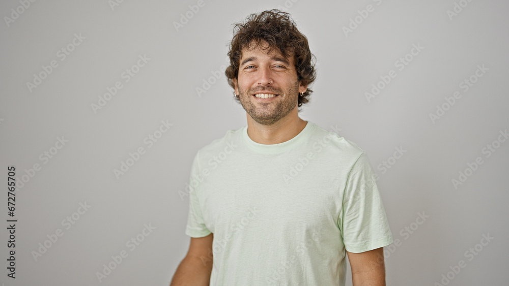 Young hispanic man smiling confident standing over isolated white background Young hispanic man smiling confident standing over isolated white background