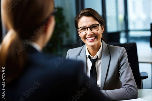 Female Manager Interviewing an Applicant In Office