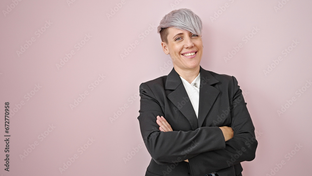 Young woman business worker standing with arms crossed gesture over isolated pink background Young woman business worker standing with arms crossed gesture over isolated pink background