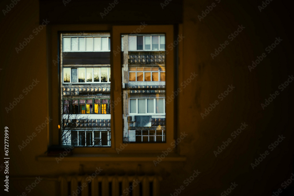 view from the window of a residential multi-storey old house. Concept of old windows and housing for the poor