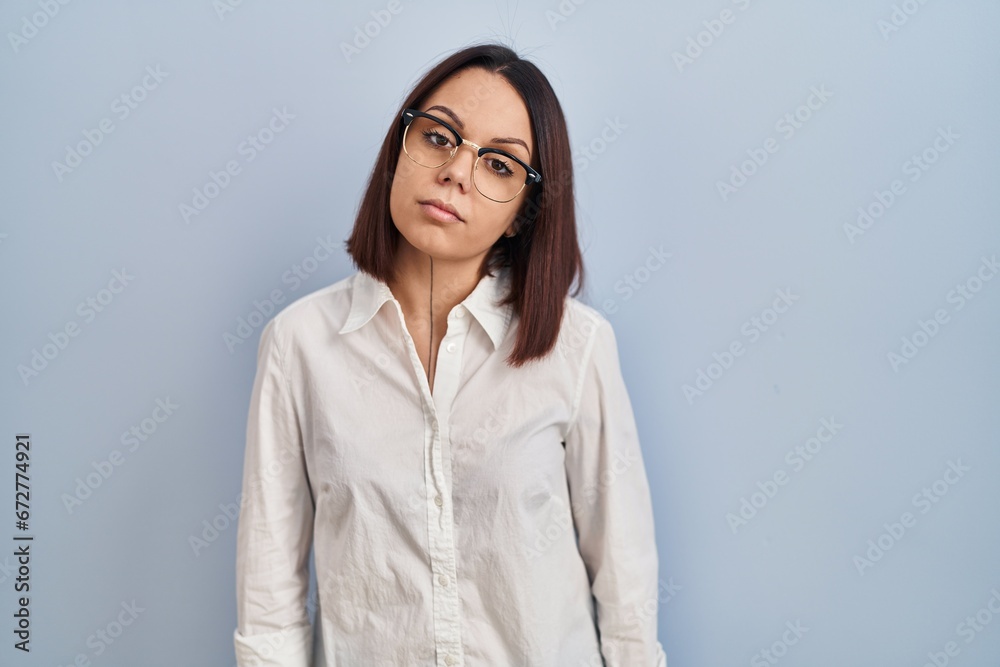 Young hispanic woman standing over white background looking sleepy and tired, exhausted for fatigue and hangover, lazy eyes in the morning. Young hispanic woman standing over white background looking sleepy and tired, exhausted for fatigue and hangover, lazy eyes in the morning.