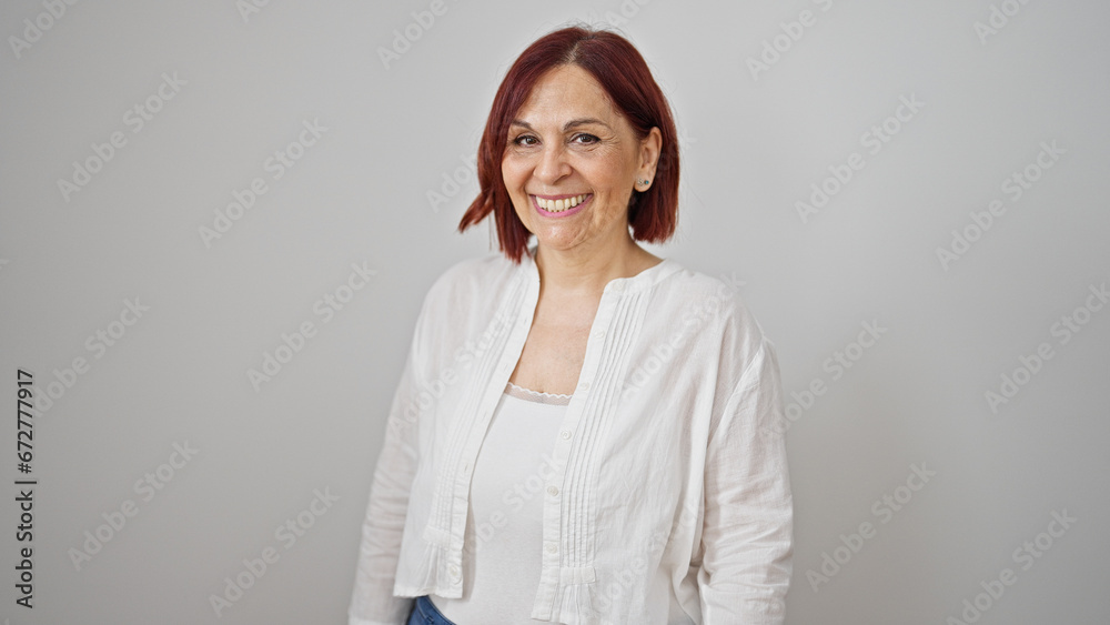 Middle age woman smiling confident standing over isolated white background Middle age woman smiling confident standing over isolated white background