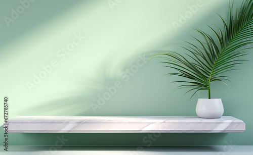 light green marble desktop with green leaves and shadow © Sergio