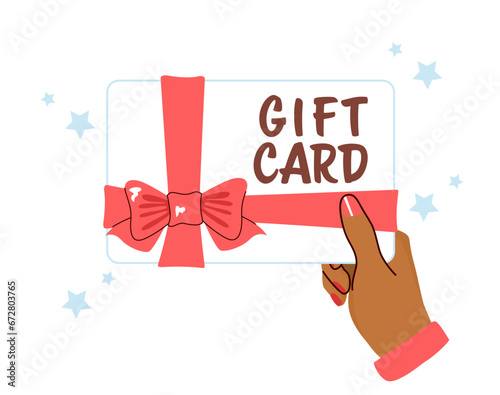 Hand Holding a Voucher Gift...