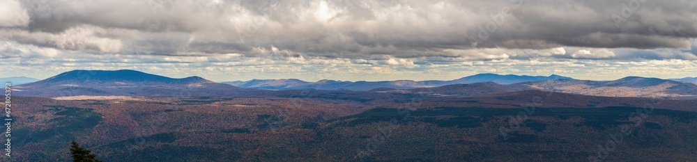 Panorama view of mountain ranges and clouds from top of Mount Equinox facing different directions on a beautiful autumn day Panorama view of mountain ranges and clouds from top of Mount Equinox facing different directions on a beautiful autumn day