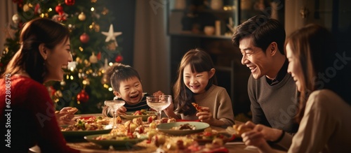 Asian Family celebrating christmas new year and. Home holiday and Christmas tree