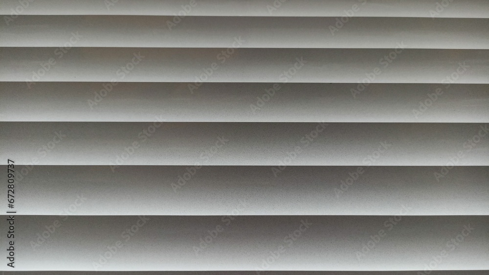 Obraz premium Window blinds with wavy gray striped