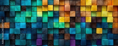 Wooden blocks  squares  cubes in green  turquoise and yellow colors for a wall texture. Grain and structure of wood. Wide format. Colorful cubes covering backdrop.