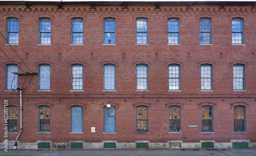 facade view of old factory building with red brick wall