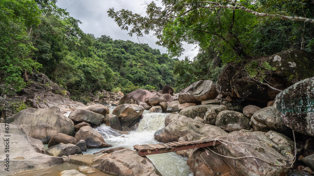 Jungle waterfall with rapid waters and large rocks in Vietnam. Jungle waterfall with rapid waters and large rocks in Vietnam.