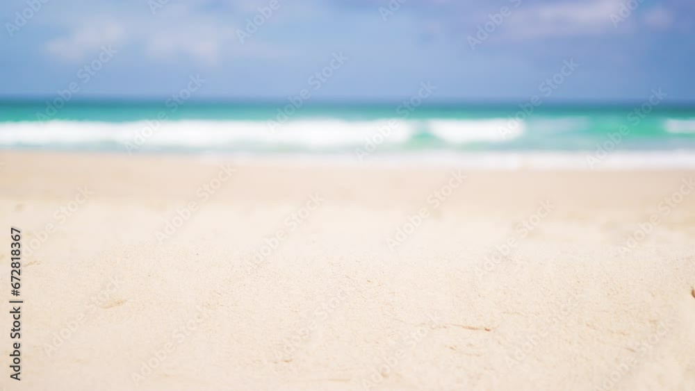 Close-up focused sandy beach blurred sky. Tropical white sandy desert beach clean. summer background. Text Space area.