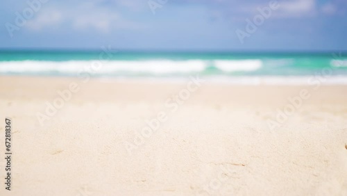 Close-up focused sandy beach blurred sky. Tropical white sandy desert beach clean. summer background. Text Space area.