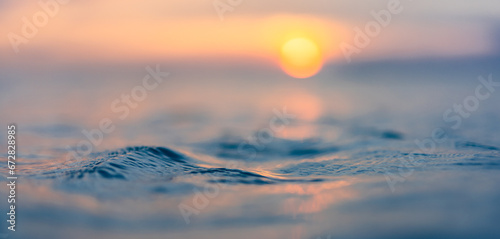 Dream meditation sunset closeup waves ripples with endless horizon. Romantic heavenly sunlight orange blue colors on sea water surface. Beautiful inspirational nature background. Panoramic art view