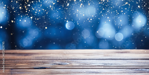 Empty wooden tabletop blue background with Christmas lights, sparkling garlands, bokeh, Christmas, New Year