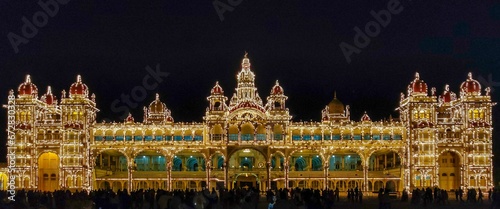 Illuminated facade of the Mysore Palace at night, India. photo