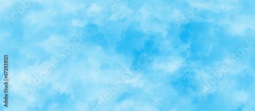  soft and lovely sky blue watercolor background with clouds, Sky clouds with brush painted blue watercolor texture, small and large clouds alternating and moving slowly on cloudy winter morning sky.