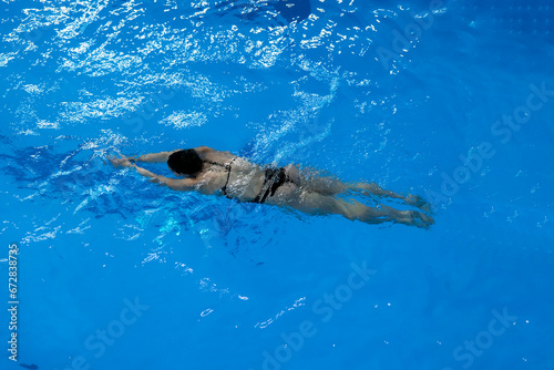 a female sport swimming athlete swimming underwater in the pool © Mihail