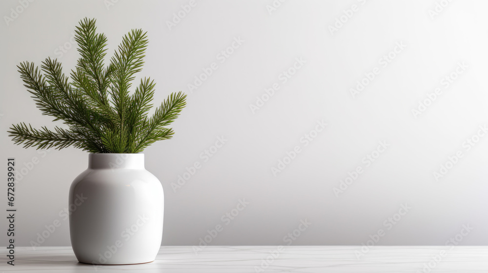 A vibrant green plant with lush leaves is elegantly placed in a white ceramic vase against a minimalist white background. A vibrant green plant with lush leaves is elegantly placed in a white ceramic vase against a minimalist white background.
