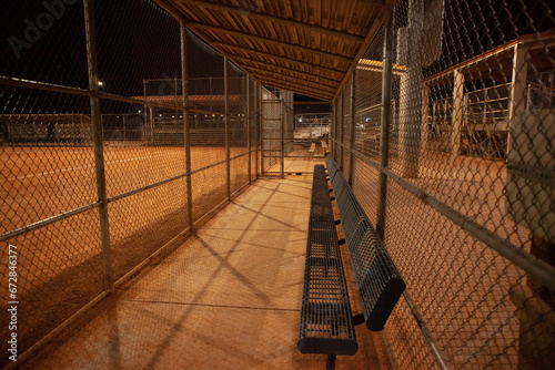 Fotografie Empty dugout at night, baseball field