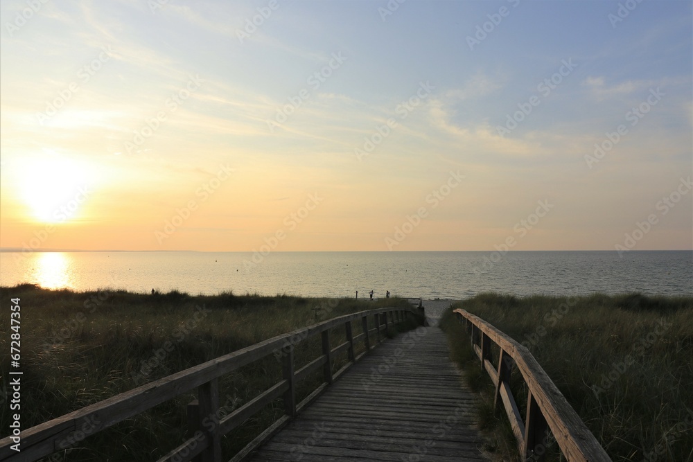 Wooden boardwalk to the Baltic Sea beach.