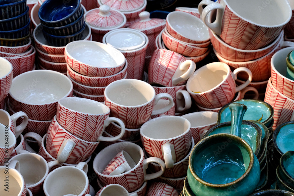 Handmade crockery and serve wares on the sale in the Pune, India, street market. Beautiful ceramic crockery selling in the flee market. Handmade crockery and serve wares on the sale in the Pune, India, street market. Beautiful ceramic crockery selling in the flee market.