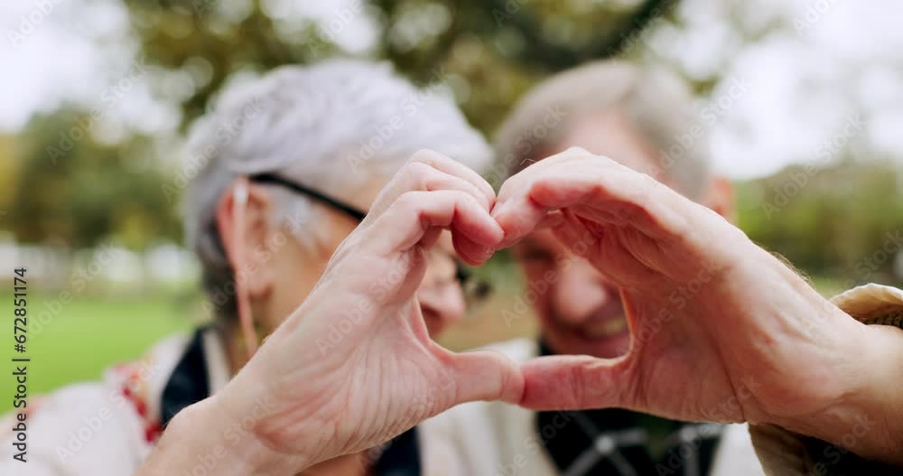 Park, love and senior couple heart sign with hands for trust, support and care together in outdoor forest or nature. Morning, man and elderly woman on retirement holiday or vacation in the woods Park, love and senior couple heart sign with hands for trust, support and care together in outdoor forest or nature. Morning, man and elderly woman on retirement holiday or vacation in the woods