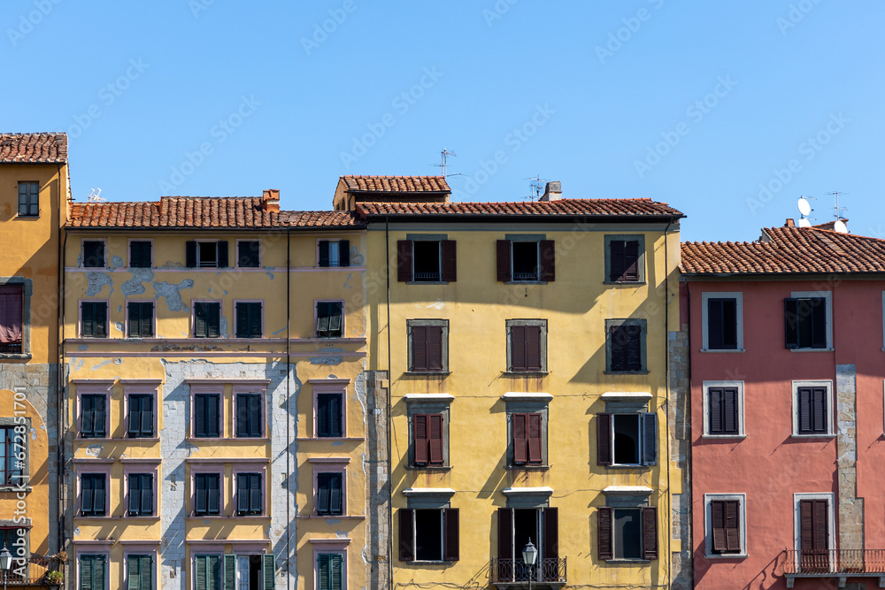 Apartment houses in Pisa, Italy. Derelict condition with plaster coming off