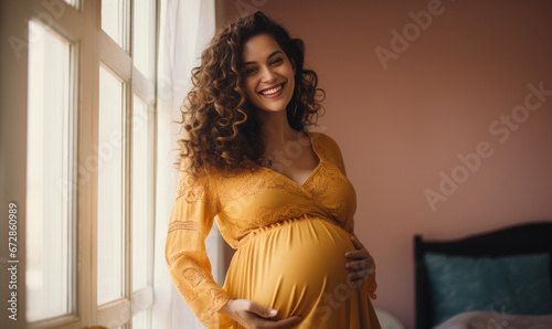 Joyful pregnant Latina with a loving touch on her abdomen.