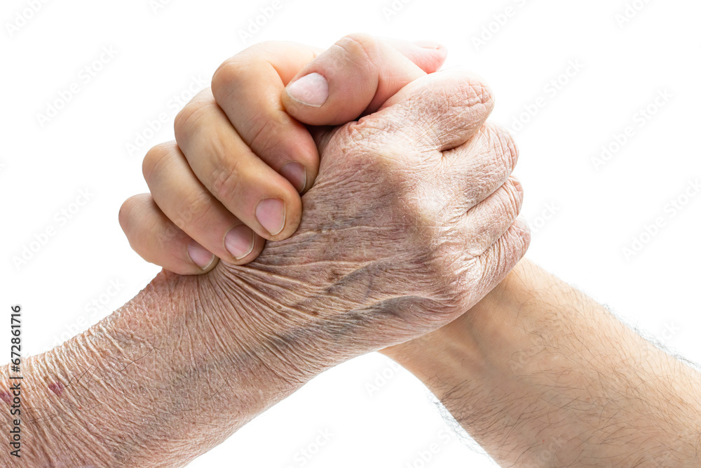 Fototapeta premium Arm wrestling concept of old hand vs young isolated on white
