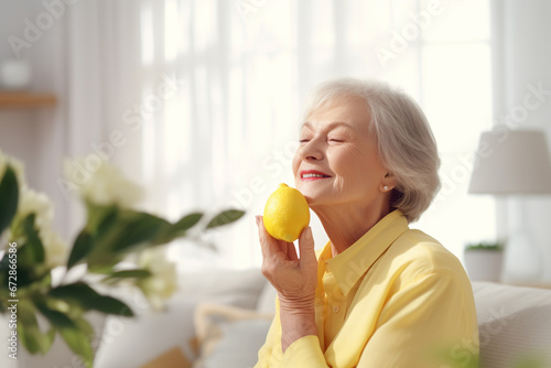 Attractive mature woman enjoying lemon aroma at home. Aromatherapy, Return of smell after Covid