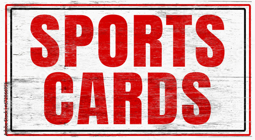 Old worn sports cards sign on wood