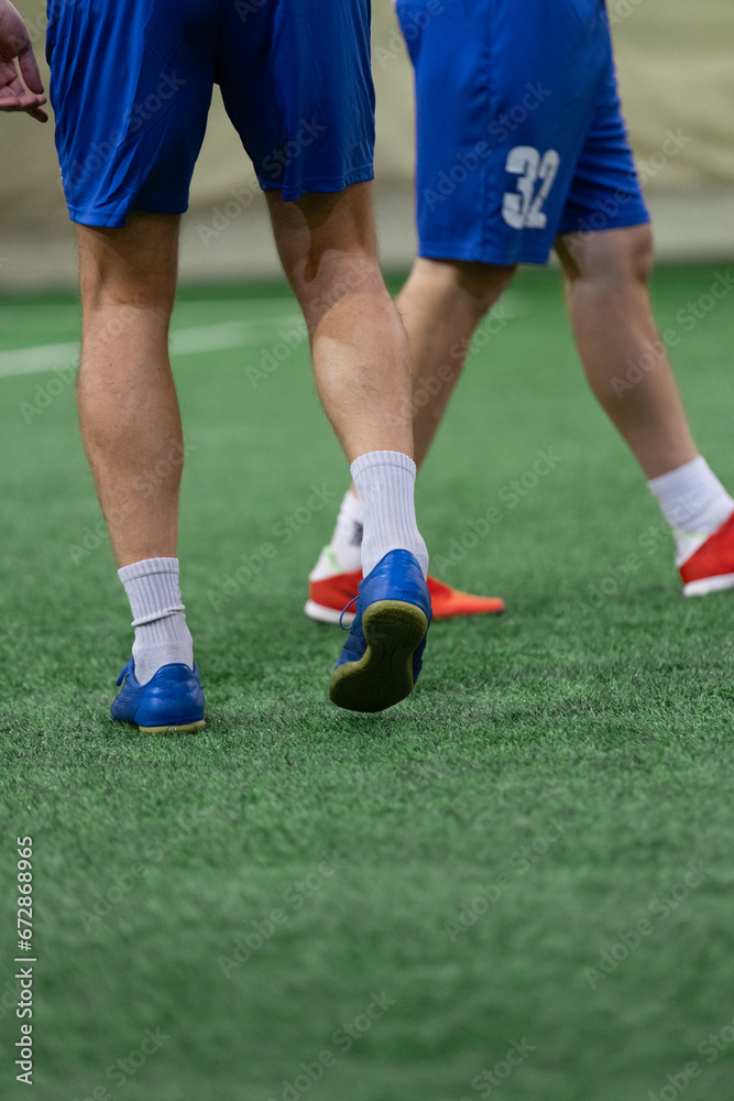 Five-a-side players walking on mini soccer terrain during the match. Five-a-side players walking on mini soccer terrain during the match.