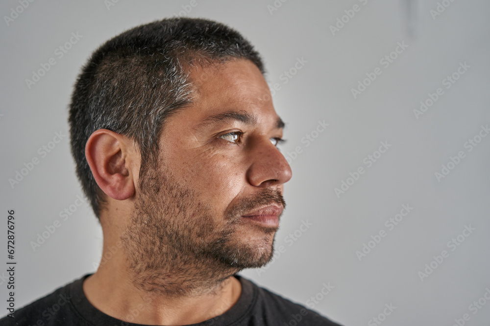 Fototapeta premium portrait of man looking to the right on neutral background