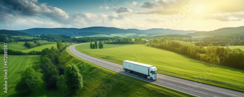 Truck on freeway top air view. Truck driving at beautiful spring landscape. photo