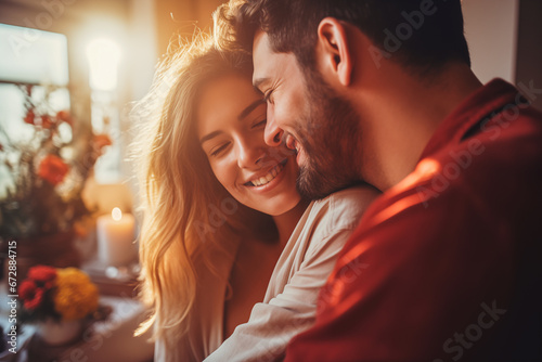 Happy Couple in love hugging at home and celebrating Valentine's Day © Enigma