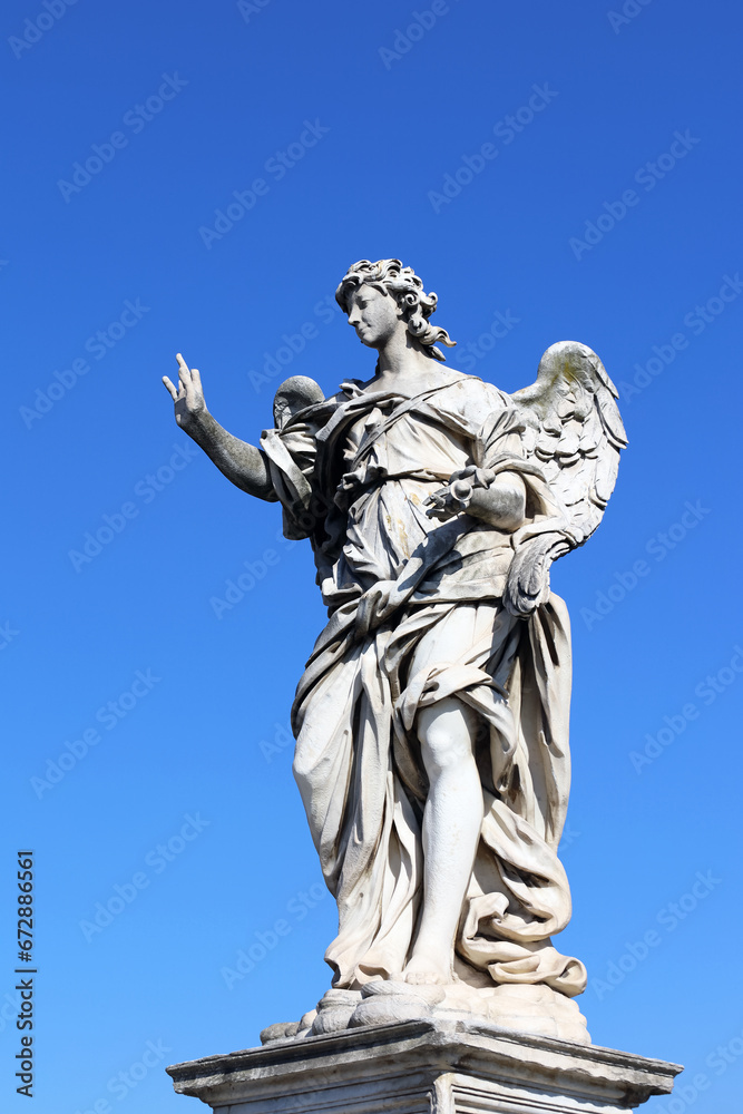 The statue of Angel with the nails by Girolamo Lucenti on Saint Angel Bridge. Perfect example of baroque sculpture in in historic center of Rome. Travel and history concept. Italian architecture.