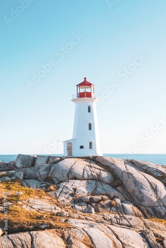 Vertical of Peggy's cove lighthouse on a rocky coastline in Scotia, Canada