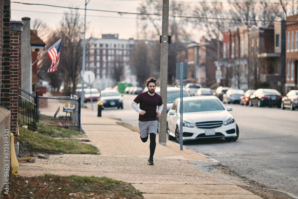 Young man running in American street