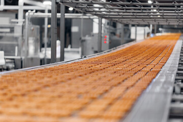 Automatic bakery plant food factory. Belgian waffles on conveyor production line