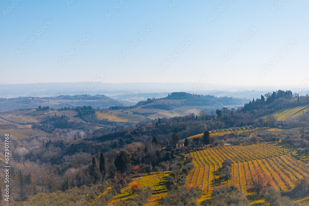Amazing view from small old town San Gimignano, Italy. Beautiful vineyards countryside landscape on sunny day. Amazing Tuscany, Europe. Travel concept.
