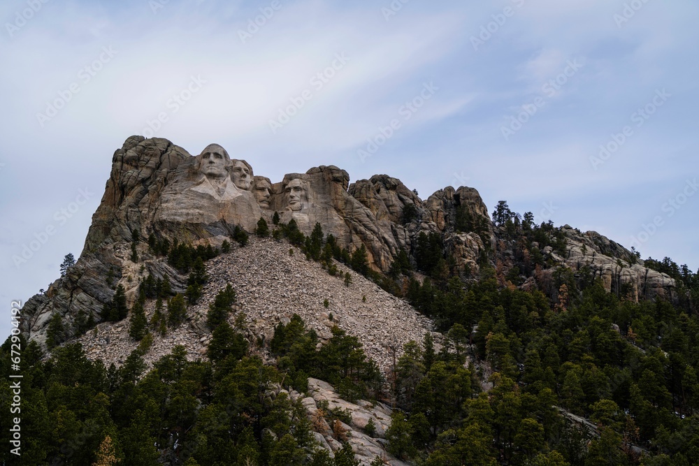 Scenic view of Mount Rushmore with lush green trees on the slope. United States.