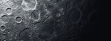 Detailed moon surface with craters and textures.