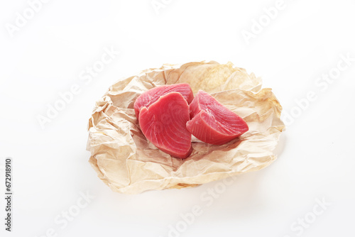 Piece of tuna on white background. natural omega. Isolated object. Copy space.