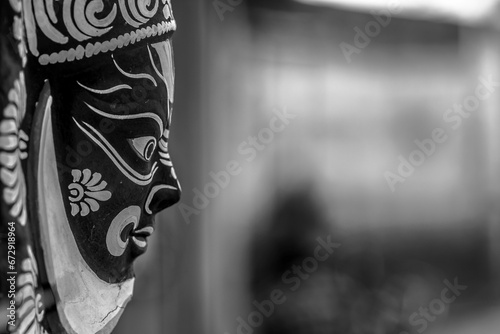 Black and white mask against a blurry background. Purulia, West Bengal, India. photo